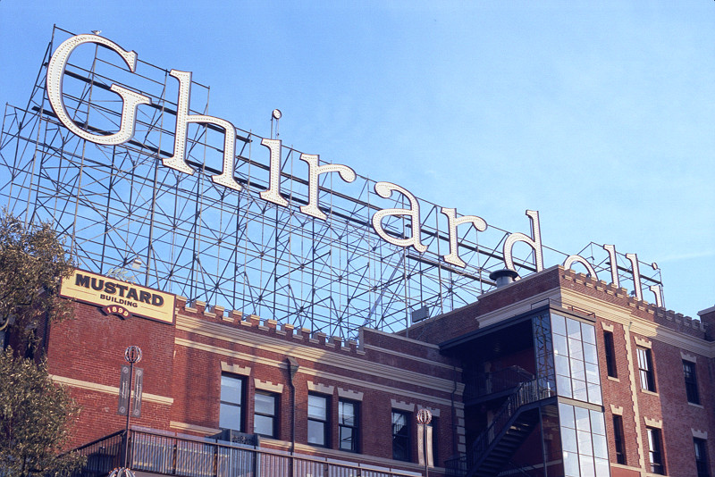 The huge sign, composed of more lightbulbs than you can count, stretches the full length of the Mustard and Cocoa Buildings in Ghirardelli Square. The camera was pointed up from the main plaza of Ghirardelli, near the Chocolate Shop. 