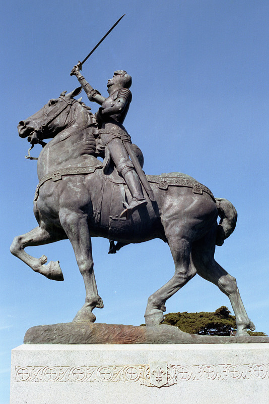 Jeanne d'Arc stands in the saddle, holding her sword high, her horse Papo walking with majestic gait, at the California Palace of the Legion of Honor. The work of sculptor Anna Hyatt Huntington.