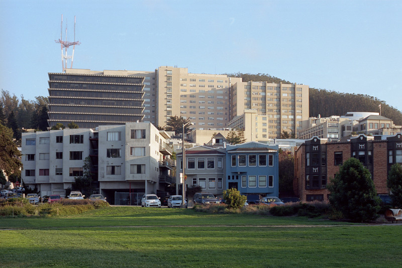 University of California San Francisco campus is sited on a hill south of Golden Gate Park, magnificent views northward over the City to the Golden Gate and Marin County. Between us and UCSF, a number of apartment buildings.