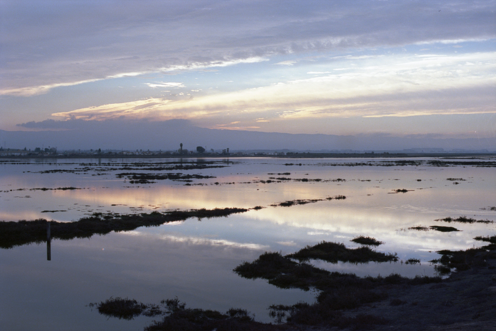 V cloud formation over Don Edwards Wildlife Refuge at Alviso has moved a little toward the south, so more of its extent toward the north now visible.