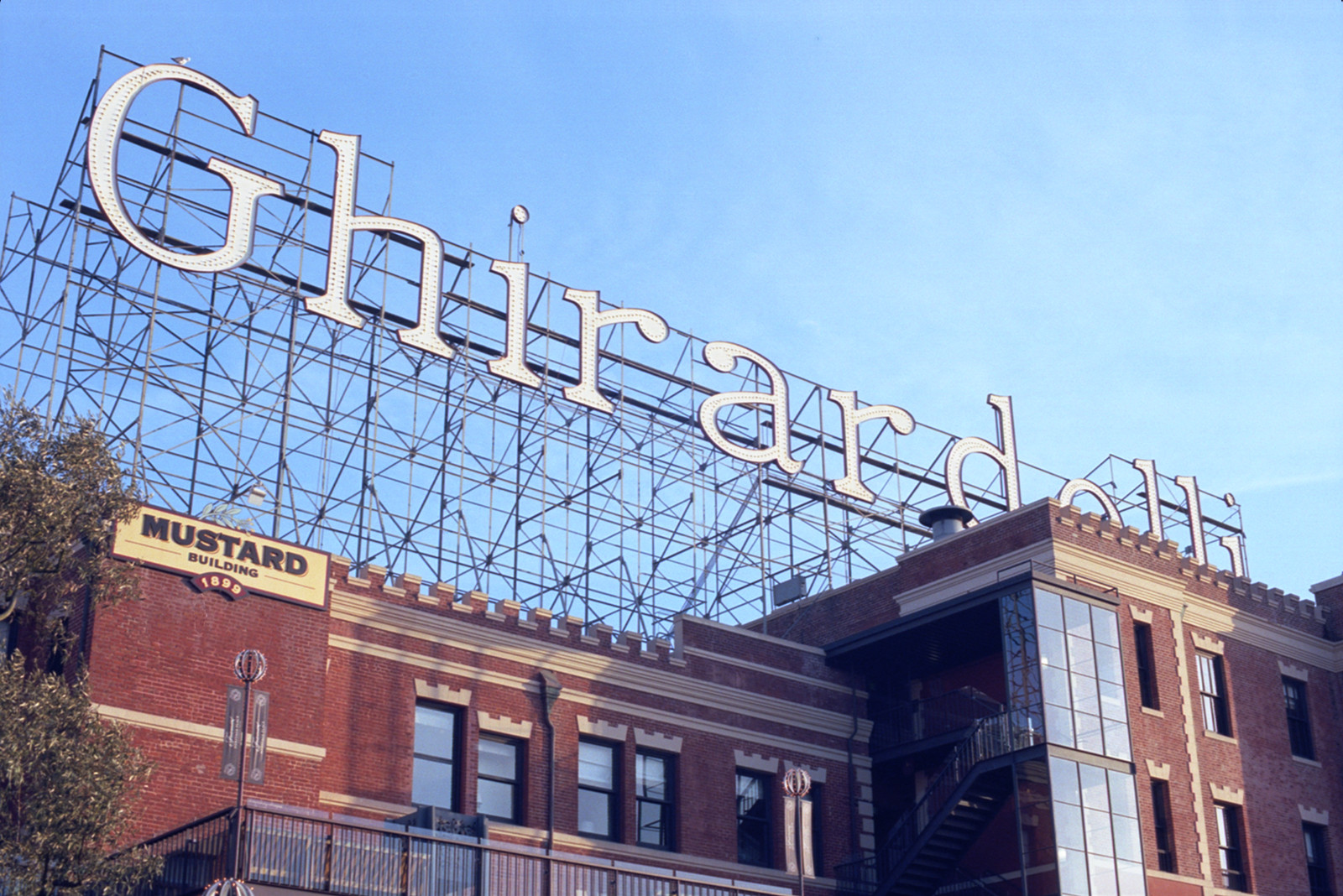 The huge sign, composed of more lightbulbs than you can count, stretches the full length of the Mustard and Cocoa Buildings in Ghirardelli Square. The camera was pointed up from the main plaza of Ghirardelli, near the Chocolate Shop. 